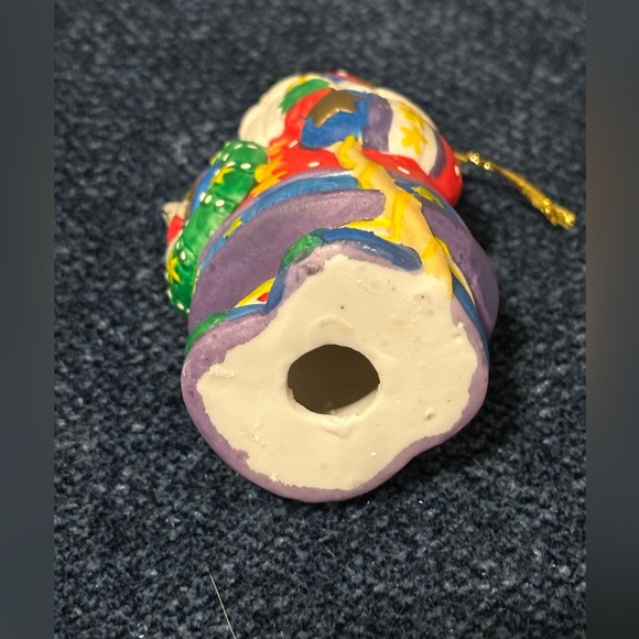 Brightly colored ceramic Santa ornament. Santa carries a tree & wreath. - Picture 7 of 10